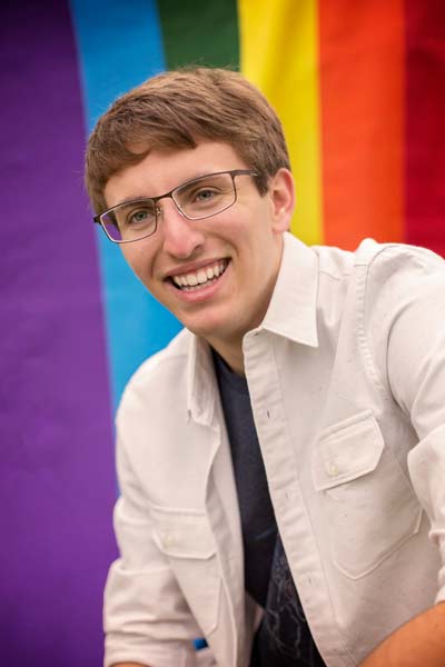 Senior Boy Sitting With Gay Pride Flag in Franklin TN | Senior Photos Moments By T