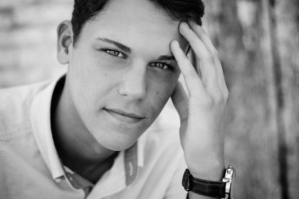 Senior Boy Sitting With Fingers On Forehead In Franklin TN | Senior Portraits Moments By T