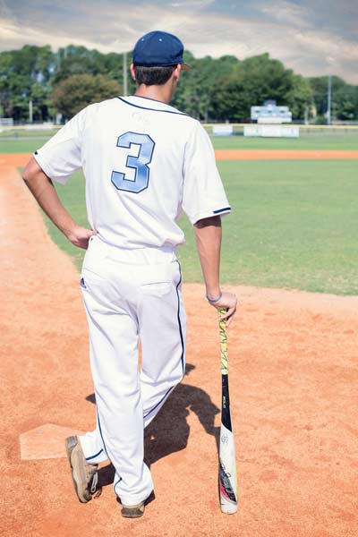 Baseball Player Leaning on a Bat in Franklin TN | Senior Photos Moments By T