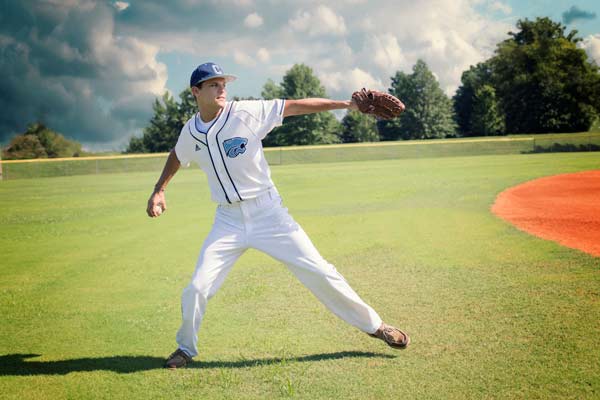 Baseball Player Throwing a Ball in Franklin TN | Senior Photoshoot Moments By T